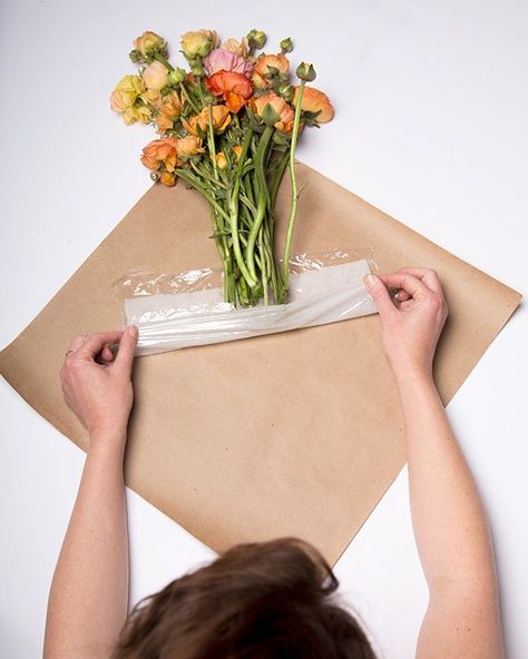 Here, a damp paper towel wrapped in plastic wrap and tucked inside brown paper wrapping will keep 'em looking healthy. Floral Arrangements, Floral, How To Wrap Flowers, Diy Bouquet, Bouquet Preservation, Bouquet Wrap, Flower Arrangements Diy, Flowers Bouquet, Flower Arrangements