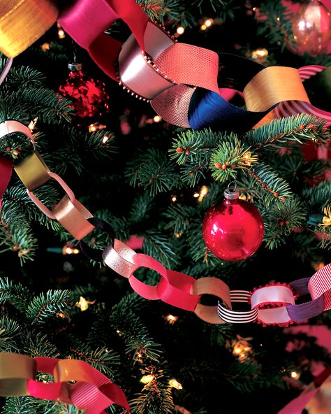 DIY Christmas Tree Garland Ideas to Personalize Your Holiday | Sorry tinsel, your time is over. These festive embellishments are the perfect garland to adorn your Christmas tree. Here's a cost-effective recyclable option: use paper ribbons from gifts to craft this decorative chain-and keep adding for years to come!  #christmas #crafts #marthastewart #DIYdecor Crafts, Christmas Crafts, Ornament, Recycling, Ribbon On Christmas Tree, Christmas Paper Chains, Christmas Tree Ribbon Garland, Diy Christmas Garland, Diy Christmas Tree Garland