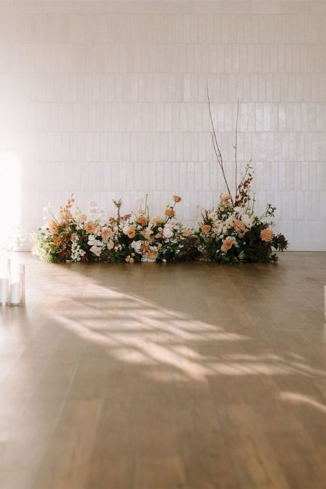 A neutral ground installation for a January wedding at One Eleven East in Austin, Texas by Ida Mayes Floral Design House. Austin Tx, Ideas, No Arch Wedding Ceremony, Ceremony Flowers, Aisle Flowers, Wedding Aisle Flowers On Ground, Floral Arch Wedding, Wedding Ceremony Backdrop, Church Wedding Flowers