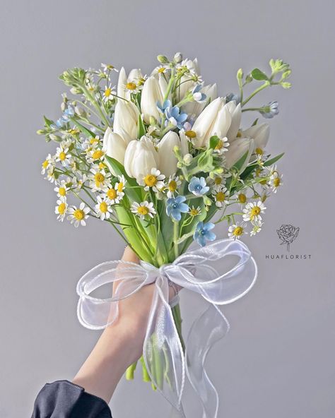 bouquet with white tulips, daisies, and blue flowers, all tied up with a tulle ribbon Bouquets, Floral, Spring Flower Bouquet, White Tulip Bouquet, Tulip Bouquet Wedding, White Daisy Bouquet, Daisy Bouquet Wedding, White Flower Bouquet, Ribbon Flowers Bouquet