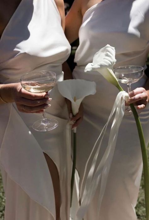 Photo of two women wearing white dresses and holding a glass of Champagne Bridesmaids, Ideas, Kayla, Bridesmaid Flowers, Single Flower Bouquet, Bridesmaid Bouquet, White Bridesmaid, Bridesmaid, Timeless Wedding