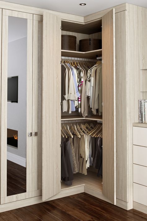 Our L-corner wardrobe solution is a great way to increase your storage space in akward corners. With the option of double hanging you can store nearly 2.5 meters of hanging space plus shelving for folded items.  #Bedroom #Bedroomdecor #Bedroominspo #Bedroomideas #Bedroomgoals #bedroomstorage #Dressingroom  #Walkincloset #Walkinwardrobe #Wardrobe #Storage #Storageideas #Storagesolutions #bespokewardrobes #madetomeasurewardrobes #hingedwardrobes #davalfurniture #fittedwardrobes #fittedbedrooms Wardrobe Storage, Corner Wardrobe Closet, Wardrobe Doors, Wardrobe Closet, Small Closet Door Ideas, Wardrobe Solutions, Wardrobe Room, Bedroom Closet Doors, Wardrobe Ideas
