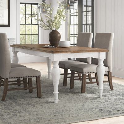 This extendable dining table brings all the farmhouse vibes to your dining room or eat-in kitchen. It's made from a blend of solid and engineered wood and features a planked tabletop with a weathered, natural finish for just the right rustic look and feel. This table sits on top of four elegant, turned legs in an antiqued white finish that adds French country flair to your dining room. Plus, it showcases a rectangular silhouette that easily seats six, and it arrives with a leaf that extends it t Home, Modern Farmhouse, Vintage, Home Décor, Inspiration, Oak Dining Table, Grey Dining Tables, Dining Table Legs, Wood Base Dining Table