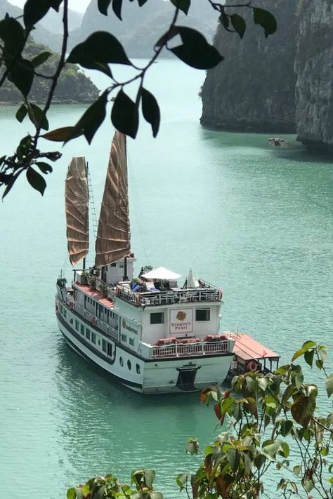 Vietnamese Junk Cruise Ship anchored in turquoise waters close to a limestone karst Bai Tu Long Bay, Vietnam, Vietnam Cruise, 3 Day Cruises, Lunch On The Beach, Junk Boat, Cruise Reviews, Us Sailing, South China Sea