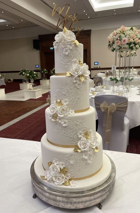 Amberley - 4 tier version of one of our most popular designs. Edible lace and sugar flowers and leaf clusters in crisp white and gold. Pastel, Engagements, White Wedding Cakes, Emerald Wedding Cake, White And Gold Wedding Cake, Cream Wedding Cakes, Gold Wedding Cake, Wedding Cakes With Flowers, White Wedding Cake