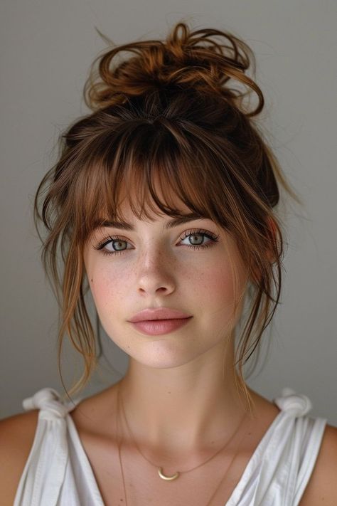 Add a sophisticated edge to your style with these 10 updos with bangs, blending elegance with contemporary chic. Short Hair Bangs Ponytail, Brunette Round Face Hair, Over 30 Haircut, Small Face With Bangs, Updo Hair Styles Easy, Ponytail With Front Bangs, Easy To Style Bangs, Very Short Bangs Long Hair, Bardot Bangs Wavy Hair