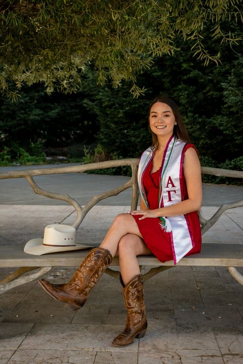 Girl in red dress sitting on a bench with her legs crossed wearing Cal girl boots and a cowboy hat Senior Pics, Country Senior Pictures, Senior Pictures, Cowgirl Boots, Senior Portraits, Ideas, Cowgirl Senior Pictures, Girls Cowgirl Boots, Cap And Gown Senior Pictures