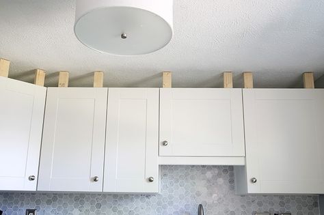 How to Install a Crown Molding to Kitchen Cabinets | JustAGirlAndHerBlog.com