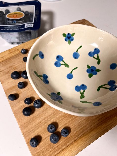 Ceramic bowl painted with blueberries #ceramics #painting #diy #diyideas #fruit #bowl Design, Mugs, Ceramic Fruit Bowl, Hand Painted Pottery, Pottery Painting, Pottery Painting Ideas, Pottery Art, Pottery Painting Ideas Easy, Pottery Painting Designs