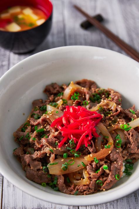Gyudon (Beef and Bowl), is a classic Japanese dish made with beef and onions that have been simmered in a sweet and savory broth. Served over rice, this easy, satisfying meal comes together in under 15 minutes. #ricebowl #beefbowl #gyudon #beeffoodrecipes Japanese Dishes, Beef Recipes, Beef, Asian Dishes, Beef And Rice, Japanese Food Sushi, Easy Asian Dishes, Beef Bowl Recipe, Beef Bowls