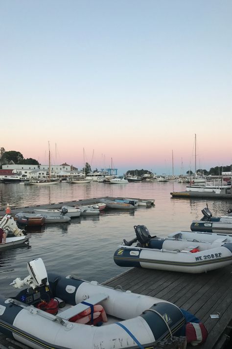Rows of boats in a harbor in Maine at sunset, striped dinghy’s and sailboats, pink sky in the background reflected into the ocean Trip, Beach Aesthetic, Maine Aesthetic, Beach Sunset Photography, Sailing Aesthetic, Coastal, Spring Trip, Beach Town Aesthetic, England Beaches