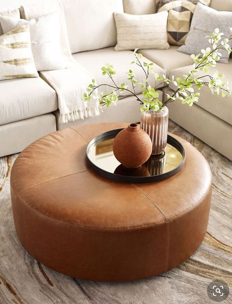 Home Décor, Leather Ottomans Living Room, Leather Ottoman Coffee Table, Ottoman In Living Room, Round Ottoman Living Room, Brown Leather Ottoman, Living Room Pouf, Living Room With Ottoman, Round Ottoman Coffee Table