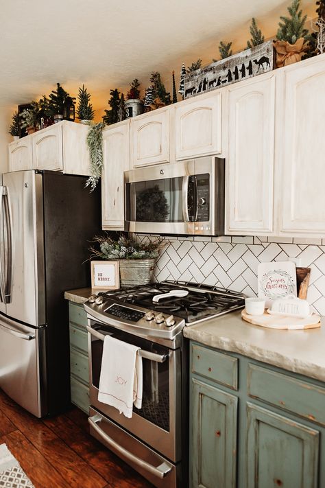 adding simple christmas trees to the top of our cabinets adds a big impact without an overwhelming amount of color. Cabinets, Industrial, Industrial Chic, Kitchen Cabinets Decor Above, Above Kitchen Cabinets Decor, Above Kitchen Cabinets, Kitchen Cabinets Decor, Decor Above Kitchen Cabinets, Cabinet Decor