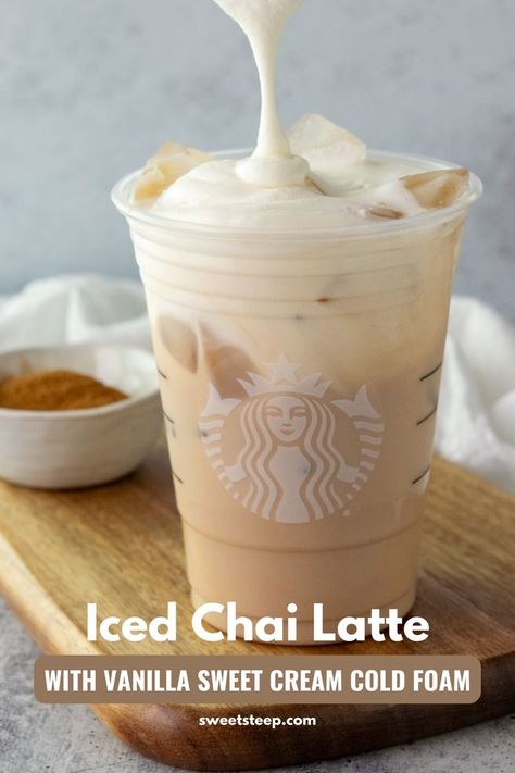 Homemade Starbucks Iced Chai Tea Latte with vanilla sweet cream cold foam being poured on top. Desserts, Vanilla Chai Tea Latte Recipe, Vanilla Chai Latte Recipe, Starbucks Chai Tea Latte Recipe, Starbucks Vanilla Chai Tea Latte Recipe, Chai Tea Latte Recipe Starbucks, Chai Tea Latte Starbucks, Starbucks Vanilla Chai Latte Recipe, Vanilla Chai Tea