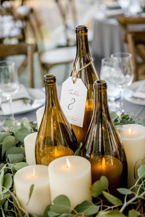 Wine bottle candle lanterns, candles and greenery make for a simple and beautiful centerpiece. Wedding Decorations, Decoration, Hochzeit, Mariage, Dekorasyon, Casamento, Deko, Dekoration, Country Wedding