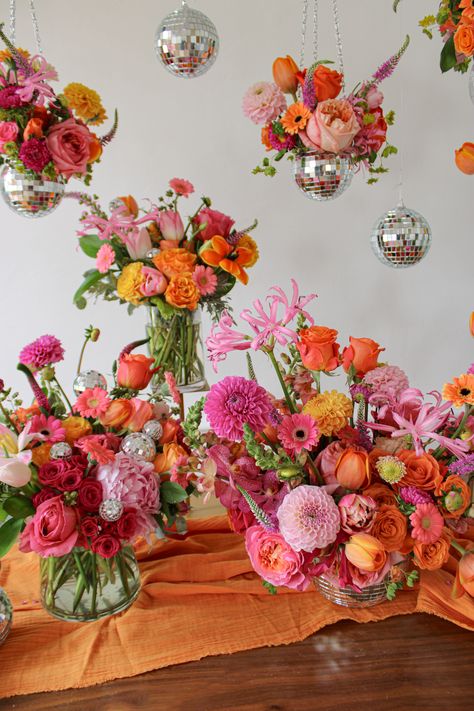 a table full of pink and orange flower arrangements with disco mirror balls Special Occasion, Floral Party, Event Flower Arrangements, Event Flowers, Flower Ball, Pink Orange Wedding Flowers, Floral Theme, Pink Yellow Weddings, Colorful Bouquet