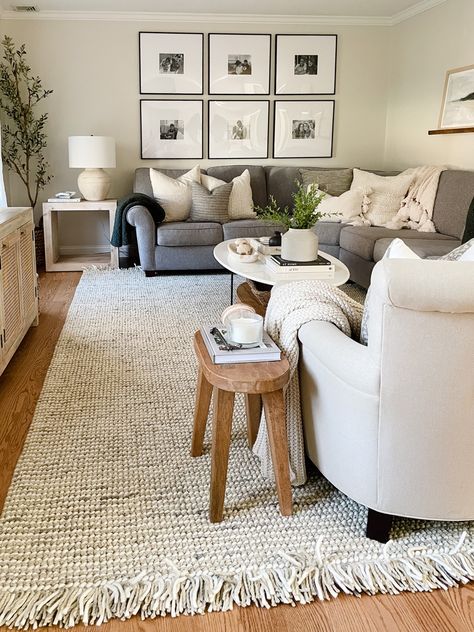 Picture Frames In Living Room, Living Room Gray And Beige, Living Room Grey Sectional Decor, Grey Tan White Living Room, Grey Couch Wood Floors, Tan Walls Grey Couch, Beige Wall Grey Couch, Grey Living Room Couch Ideas, Gray Couch Farmhouse Living Room