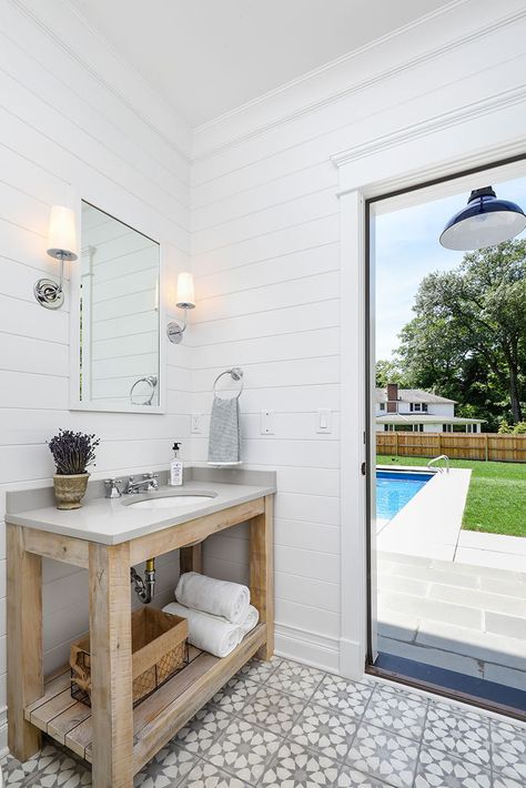 The room was designed with outdoor access leading to the pool and open-air shower. Small Pool Bathroom Ideas, Small Pool Bathroom, Pool House Bathroom, Pool House With Bathroom, Pool Bathroom Ideas, Bathrooms Remodel, Outdoor Bathroom Design, Pool Bathroom, Outdoor Pool Bathroom Ideas