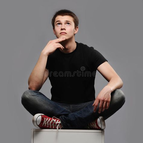 Thinking. A young man sitting with his legs crossed and thinking about something , #AD, #man, #young, #Thinking, #sitting, #thinking #ad Anton, Models, Design, Drawing Reference Poses Male Sitting, Crossed Leg Reference, Thinking Pose, Leg Reference, Sitting Pose Reference, Mad Face