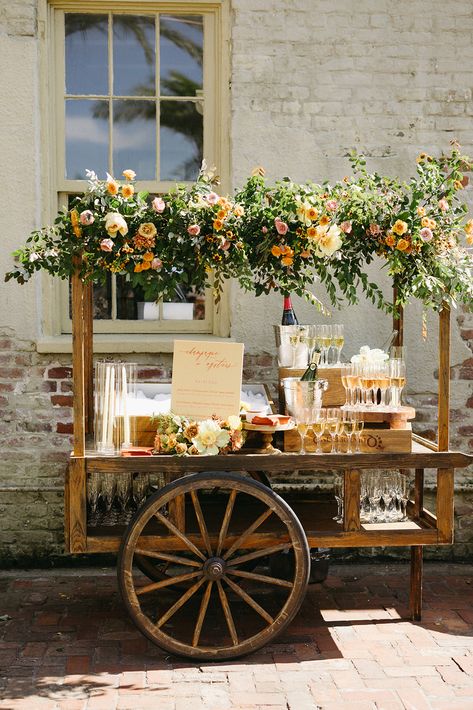 Discover Lovegood Rentals, the top choice for wedding and event furniture rentals in New Orleans! From their enchanting Merchant's Cart transformed to an elegant Champagne Station with fresh oysters and florals following, we've got everything you need to make your special day unforgettable. Explore our must-have pieces and create the dream Nola event you deserve. | New Orleans Warm Toned Summer Race & Religious Wedding w. Lovegood Wedding & Event Rentals | Vintage Furniture & Decor Wedding Decorations, Wedding Receptions, Wedding Venues, Outdoor Wedding Decorations, Outdoor Wedding, Intimate Weddings, Wedding Events, Wedding Rentals, Wedding Reception