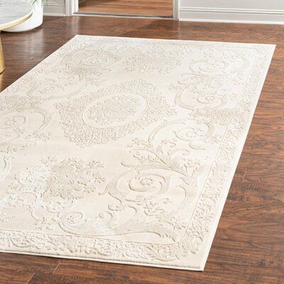 This area rug sets a subtle foundation for your space with its light palette and floral print. It features a swirling design of flower motifs in ivory hues, grounding your room in a farmhouse feel. This rug is power-loomed from polyester and polypropylene, and its medium 0.5" pile height offers a versatile addition to nearly any room. Though this rug includes a jute backing, you may want to pair it with a rug pad for extra traction (sold separately). | Laurel Foundry Modern Farmhouse Senter Rug White Rugs, Modern Farmhouse, Rugs, Ivory Rug, White Rug, Beige Rug, White Area Rug, Colorful Rugs, Pink Area Rug