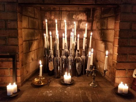 Halloween decorations: Tier wine bottles in fireplace. Melt wax and drip around bottles. Much quicker than trying to get natural drips from candles. #poiriersemporium Décor, Halloween Decorations, Noel, Boda, Victorian Halloween, Decor, Broom, Halloween Candles, Candle Aesthetic