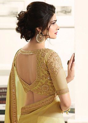 Beautiful saree blouse in yellow with golden embroidery | Please email at hello@wittyvows.com for credits | Peephole cutout blouse design with elbow length sleeves | Latest and trending saree blouse designs | Indian bridal fashion | Bridal couture | Prachi Desai | Bridal fashion | Trousseau | Couture |  #wittyvows #bridal #indianbride #blouses #bridetobe #fashion #couture #bridesmaids #bridalfashion #asianbride #bride #trousseau #style #trending #saree #prachidesai |
