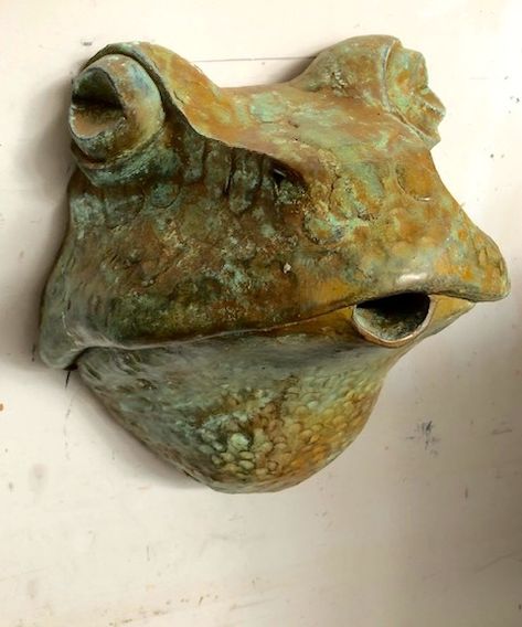 The cold cast resin bronze frog head spout can be wall or plinth mounted to create a tumbling water feature. Ferric green finish and sized 35 x 35cm Ceramic Frogs, Pottery Sculpture, Pottery Art, Ceramic Animals, Sculpture Clay, Bird Bath Garden, Ceramic Mask, Ceramic Figures, Ceramics Ideas Pottery