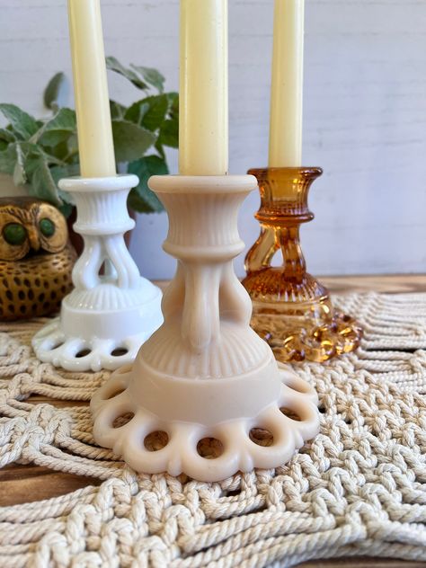 "Lovely set of 3 Westmoreland Vintage Taper Candle Holders in the patter Doric Lace.  1 pure White Milkglass, 1 Amber Glass, and 1 is a Satin Glass, the color is a very pale peachy beige color.  I think the 3 colors beautifully complement each other.  Will make a beautiful statement centerpiece on your dining table, end tables, entryway table.  Perfect for everyday or spcial occasions, could add any color taper candles for extra pop.  Works beautifully in any decor but especially perfect for Cot Vintage, Candles, Candle Holders, Candlestick Holders, Candle Holder Set, Taper Candle Holders, Candle Decor, Lace Candle Holders, Amber Glass