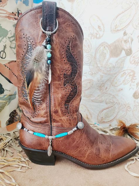 "Western Cowboy Boot Bling, Boot Topper made with real feathers, beads and a silver colored metal feather. Handmade by me in the U.S. by me. Listing is for one feather Boot Topper - Boot Bracelet sold separately. Metal ring is 1.25\" in diameter. I have other Boot Bling Toppers and Boot Bracelets: https://www.etsy.com/shop/BlueEyesDesignsHB?ref=simple-shop-header-name&listing_id=921398039&section_id=36661297 I can make matching choker, Cowboy Western Hatbands, bracelet, necklace and more. Thanks Crafts, Diy, Cowboy Hat Bands, Cowboy Boot Bling, Cowboy Accessories, Cowboy Hats, Western Cowboy Hats, Cowboy Boot Crafts, Cowboy Boot
