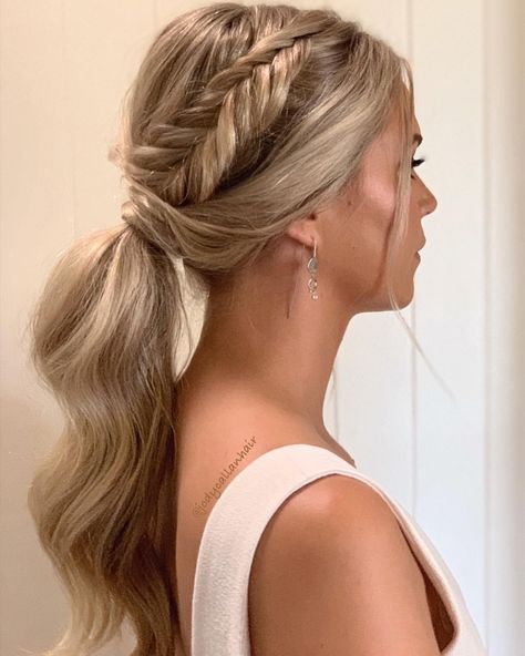 Beautiful fishtail braided ponytail on long blonde hair. Looking for some hair inspo? Get ready to turn heads this Valentine's Day with these stunning hairstyles! From romantic updos to flirty curls, we've got you covered. Whether you're celebrating with your special someone or hitting the town with your friends, these hairstyles will make you feel extra beautiful. Fishtail Braid Updo Wedding, Braided Updo Wedding, Fishtail Braid Hairstyles, Homecoming Hairstyles Updos, Prom Ponytail Hairstyles, Bridesmaid Hair Ponytail, Ponytail Updo, Fancy Ponytail, Prom Hairstyles For Long Hair