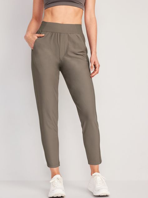 rib-knit back waist and sides diagonal hip pockets faux fly go-dry wicks moisture sits at belly button relaxed hip and thigh tapered leg hits at ankle 26 1/2" regular inseam models are approx.  5'9" and wear sizes s (4), l (12) and xl (18) Plus Size Outfits, Trousers, Wardrobes, Old Navy, Dressing, Pants For Women, Compression Fabric, High Waisted, Work Pants