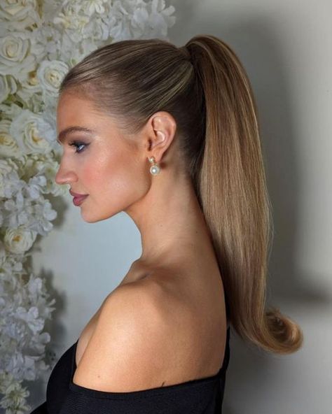 Rachel | Calgary Bridal Hair on Instagram: "Sleek Barbie Pony for the Feed🫶🏻  Chic, Secure, and oh so Snatched thanks to…  @kenraprofessional texturizing Taffy  @schwarzkopfpro Osis 2 and powder  And @moroccanoilpro texturizing spray   The go to Rehearsal Dinner or Reception Party hair for your 2024 wedding 💍  Accessorized with @joannabisleydesigns  earrings  Model (the stunning) @julia.vlodova   On the new RJStyles floral back drop 🤤  #yyc #yycbride #yychair #yycbride #albertabride #albertawedding #haireducation #canadianhairstylist #ponytail #oneshot #btconeshot24_specialeventstyling #beyondtheponytail #weddinghairinspo #weddinghairideas"