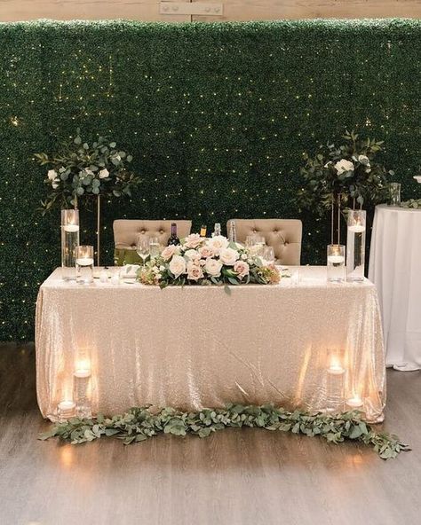 A greenery wall with lights and some greenery decor of the tables and stands look cool and fresh / Modern Neutrals Wedding Top Table, Wedding Centrepieces, Rustic Wedding Decorations, Modern Wedding Decor, Wedding Table Decorations, Wedding Reception Backdrop, Wedding Centerpieces, Wedding Table, Rustic Wedding