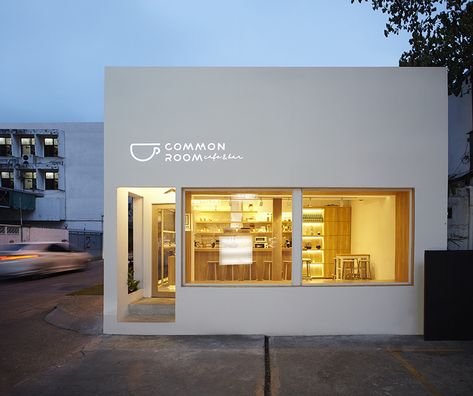 party space design has created a simple white construction for common room cafe in bangkok. Common Room, Space Design, Bangkok, Bathroom Lighting, House Exterior, Lighted Bathroom Mirror, Bathroom Mirror, Cafe, Exterior
