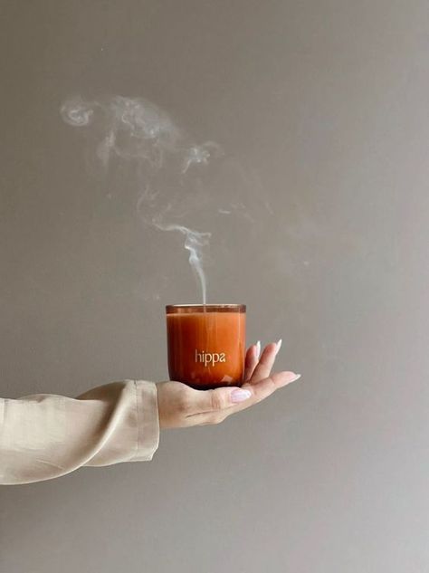This pin features a stunning image of a woman embracing the tranquility of a lit candle. The woman is photographed in a beautiful, serene moment, exuding peace and harmony. This photo is perfect for those in search of a serene escape. Instagram, Fotos, Fotografie, December, Photo Candles, Aesthetic Candles, Candle Photoshoot, Branding Photos, Bougie