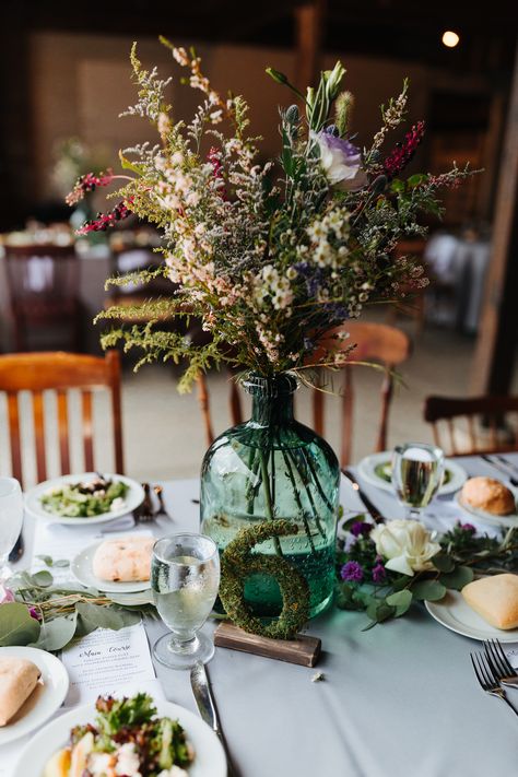 These tables at a Johnson's Locust Hall Farm fall wedding were just amazing. The moss covered table numbers along with the green glass for vases are stunning! Wildflower Wedding Centerpiece | Rustic Wedding Centerpieces | Wedding Table Decorations Tables, Fall Wedding Centerpieces, Rustic Wedding Centerpieces, Fall Wedding Centerpieces Rustic, Herb Wedding Centerpieces, Vintage Centerpiece Wedding, Moss Wedding Table, Vintage Wedding Centerpieces, Moss Centerpiece Wedding