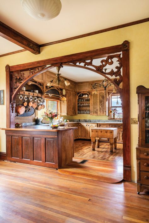 The main kitchen  is semi-enclosed behind a fretwork-embellished opening and a peninsula. The custom threshold bridges the difference in floor levels. Dining Room, Home Interior Design, Home Décor, Home, Victorian Interiors, Dining Room Victorian, Wood Interior Design, Victorian House Interiors, Cottage Interiors