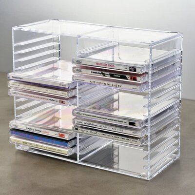 STACKABLE organizer holds 30 standard sized jewel CD casesRubber feet on the bottom allow each holder to be STURDY when stacked10-1/2-inch length by 4-7/8-inch width by 8-3/4-inch height is JUST RIGHT for entertainment centers not just for CDs, also great for jewel case computer games keep CDs organized and at your fingertips | EcoDecors Stackable Media Shelves Plastic, Size 8.75 H x 10.5 W x 4.88 D in | Wayfair Design, Organisers, Organisation Ideas, Cd Rack, Cd Storage, Cd Shelves, Cd Organization, Rack Shelf, Organization Ideas