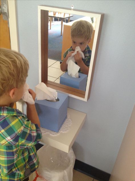 My co teacher had the best idea! We made a nose wiping station. We set up a mirror, shelf, tissues and a trash can. The kids can look I the mirror and see how to wipe their noses. We will use it later for emotion cards and other exercises! Pre K, Montessori, Daycare, Toddler Classroom, Hand Sanitizer, Preschool Rooms, Preschool Teacher, Preschool Classroom, Classroom Environment