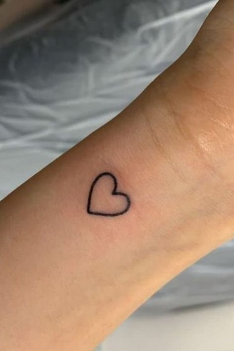 25 Amazing Heart Tattoos For Women To Try In 2023 Hand Tattoos, Small Wrist Tattoos, Tattoo, Small Heart Tattoos, Tiny Wrist Tattoos, Wrist Tattoos For Women, Tattoos For Daughters, Hand Tattoos For Women, Tattoos For Women Small