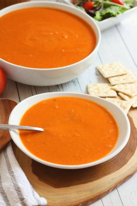 If you're a fan of Panera Tomato Soup, you're going to love this copycat recipe. It's just as creamy and delicious as the original, but much less expensive to make at home. Plus, you can customize it to your own taste by adding more or less garlic and herbs. This creamy tomato basil soup goes perfectly with our Sourdough Grilled Cheese Sandwich, Chicken Salad without Celery, Grinder Sandwich, or BLT Wraps! https://smellslikedelish.com/panera-tomato-soup/ Mac, Tomato Soup, Bagel, Fan, Panera Tomato Soup Recipe, Panera Creamy Tomato Soup Recipe, Copycat Panera Tomato Soup Recipe, Creamy Tomato Soup, Creamy Tomato Soup Recipe