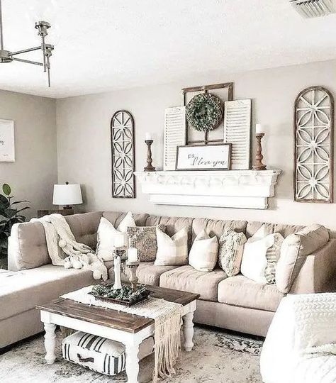 a chic neutral farmhouse living room with a tan sectional, a shelf with shutters and wooden candlesticks, a low coffee table Home Décor, Home, Living Room Designs, Farmhouse Living Room Decor Ideas, Farmhouse Decor Living Room, Modern Farmhouse Living Room Decor, Modern Farmhouse Living Room, Home Living Room, Modern Farmhouse Living