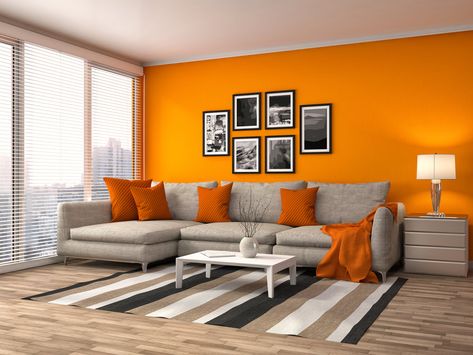 Orange never fails to give life to a dim and lonely living room. The wall in bright and cheerful orange is supported with the orange throw pillows and orange cloth resting on the sofa. Interior, Home Décor, Living Room Decor Orange, Burnt Orange Living Room, Grey And Orange Living Room, Living Room Orange, Living Room Colors, Living Room Grey, Living Room Decor