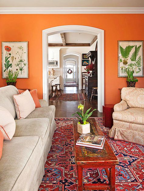 Even traditionally minded decor can benefit from a jolt of unexpected wall color. Here, a bright spice orange infuses a classic living room with energy. The color is used in small doses throughout the room so the wall color doesn't appear as an afterthought. The Color: Bryce Canyon -- Benjamin Moore Home Décor, Paint Colours, Inspiration, Interior, Orange Paint Colors, Orange Walls, Orange Decor, Paint Colors For Living Room, Orange Rooms