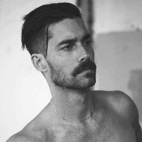 A Peaky blinder haircut featuring skin shaved sides and back, contrasted with subtly long hair on top with a deep-part Beard Styles, Mens Hairstyles With Beard, Best Beard Styles, Beard Trend, Mens Hairstyles Fade, Hair And Beard Styles, Beard, Trending Mens Haircuts, Mustache Styles