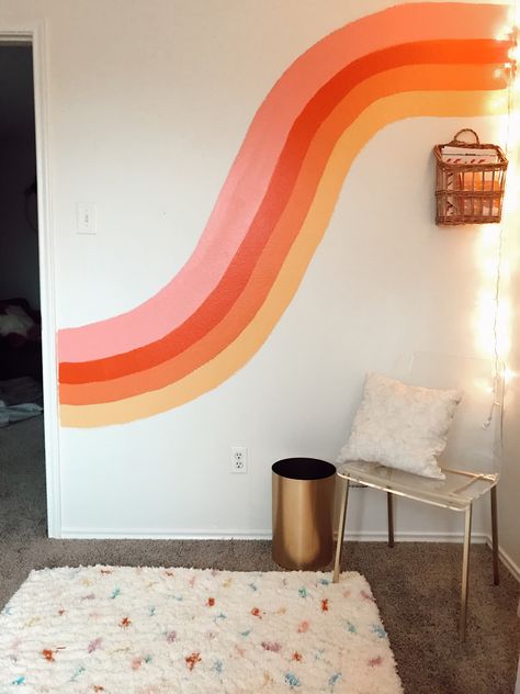 Free hand painted, fun and colorful mural wall.