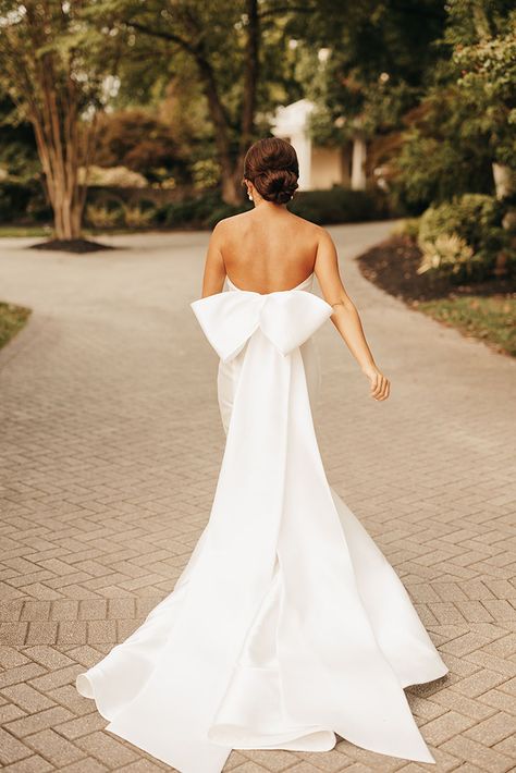 Classic and Elegant Summer Bride Style with a Full Neat Bridal Updo and Low Back Mermaid Fit Gown with Large Pressed Bow Wedding Dress, Wedding Dresses With Bows, Fitted Wedding Dresses, Wedding Dresses Strapless, Simple Fitted Wedding Dress, Wedding Dresses Elegant Classy, Simple Wedding Dress Strapless, Fitted Wedding Dress, Elegant Wedding Gowns