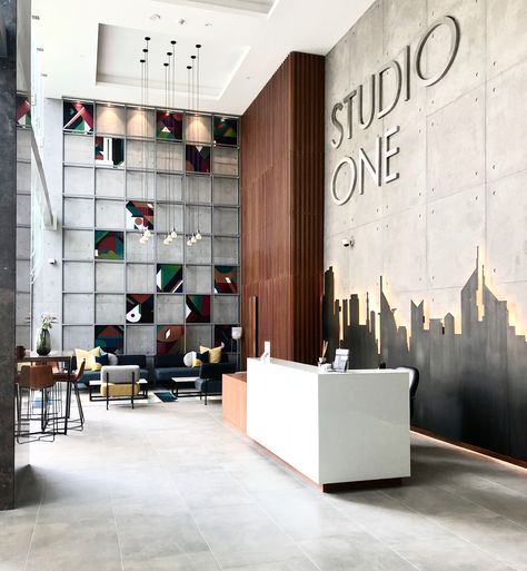 Studio One is one of the latest developments here in Dubai & it just opened it doors to its residents - designed & furnished by @EMDE_Design #urban #modern #lobby #lobbydesign #design #concrete #artwork #decor Office Lobby Design Waiting Area, Corporate Office Lobby Design, Office Lobby Interior Design, Office Lobby Design, Office Reception Design, Corporate Office Entrance Design, Office Entrance Lobby, Open Office Wall Design, Industrial Lobby Design