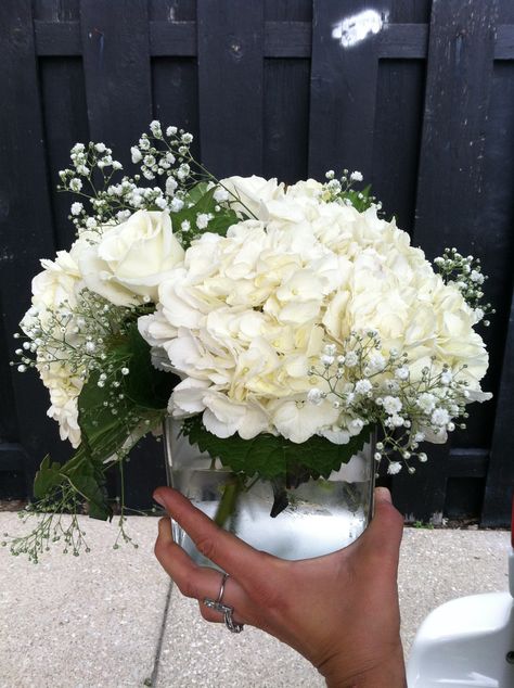 white hydrangea, white rose, and babysbreath centerpiece in clear glass cube (wedding) Floral, Hydrangea Centerpiece Wedding, White Flower Centerpieces, Hydrangea Centerpiece, Hydrangeas Wedding, Flower Centerpieces Wedding, Hydrangea Arrangements, Floral Centerpieces, Flower Centerpieces